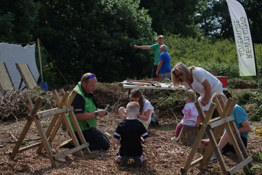 Whittling and carving at a community event | Microsite | Microsite