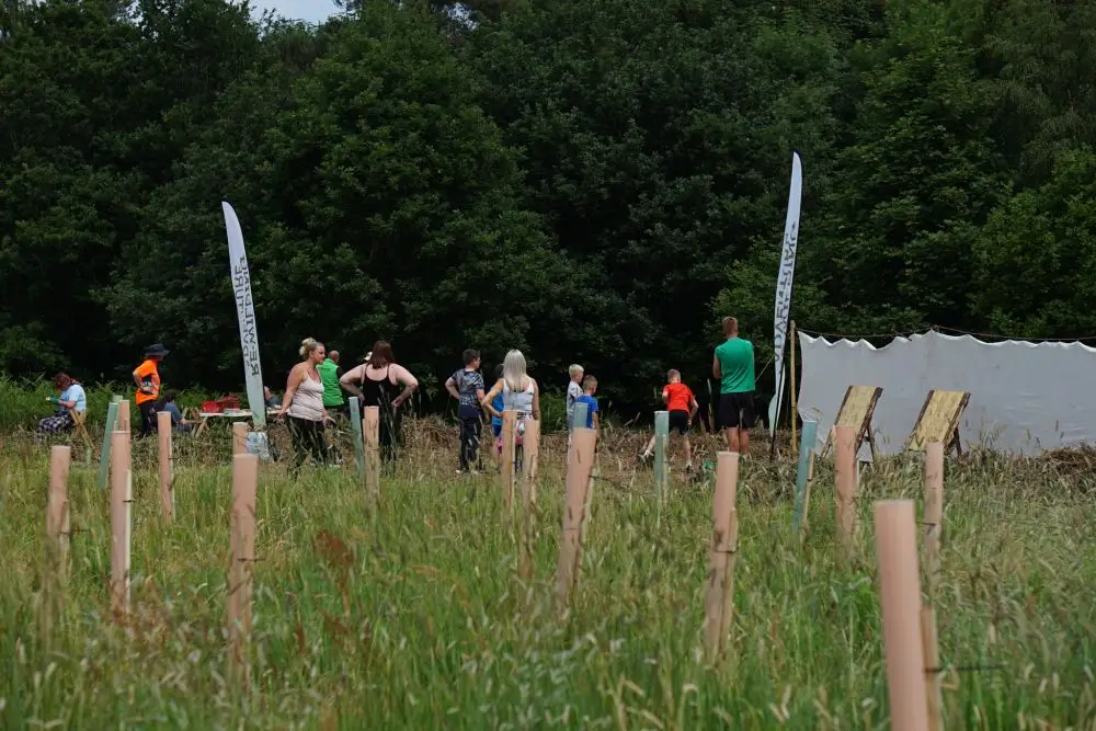Children and adults joining in with a community event | Microsite | Microsite
