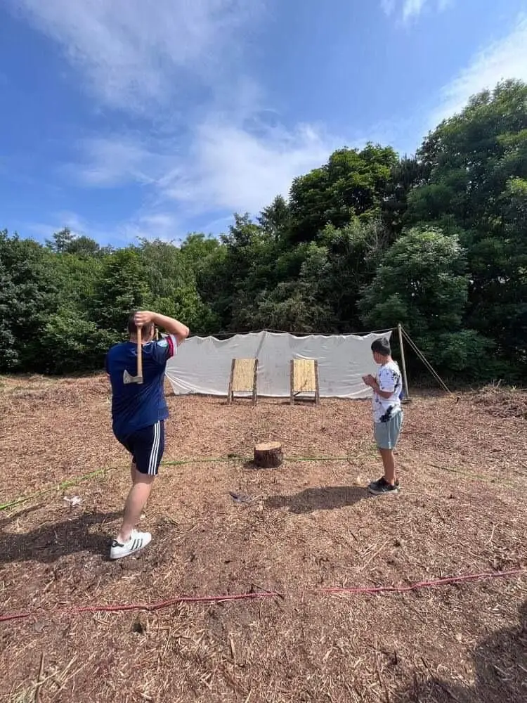 Axe throwing at a community event | Microsite | Microsite