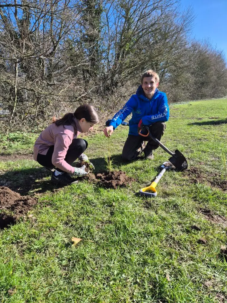 Young child joins in with planting trees educational | Microsite | Microsite